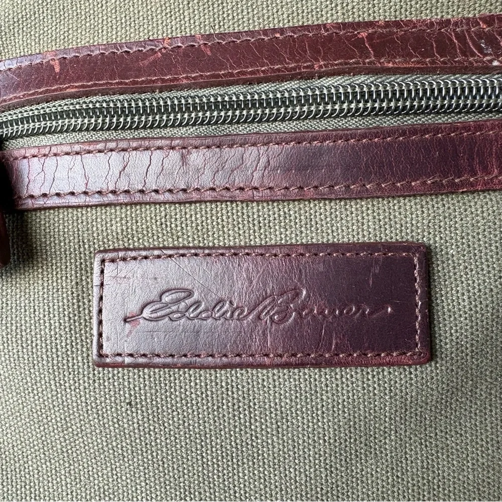 Vintage Eddie Bauer, green canvas w/leather trim handles/bottom top snap closure